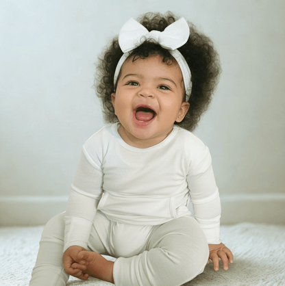 Baby wearing Stretchaboo Lightning White Bamboo Baby Grow