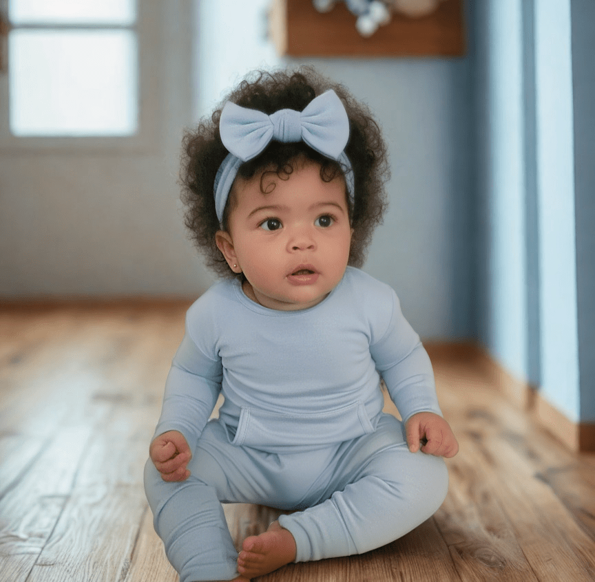 Baby wearing Stretchaboo Volare Light Blue Bamboo Baby Grow